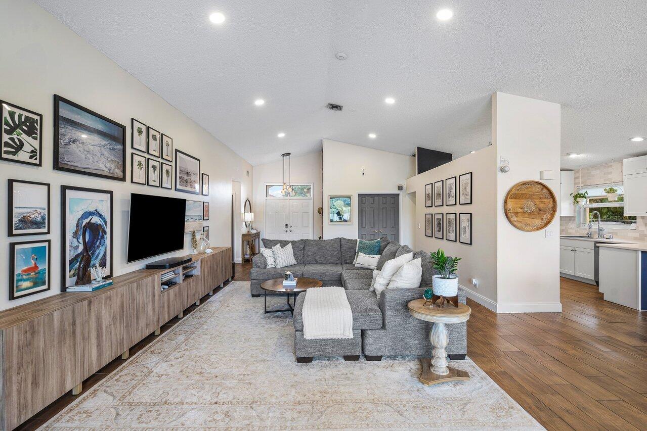 8541 Nadmar Avenue Boca Raton, FL 33434 - Photo 6 of 39 a living room with furniture and a flat screen tv