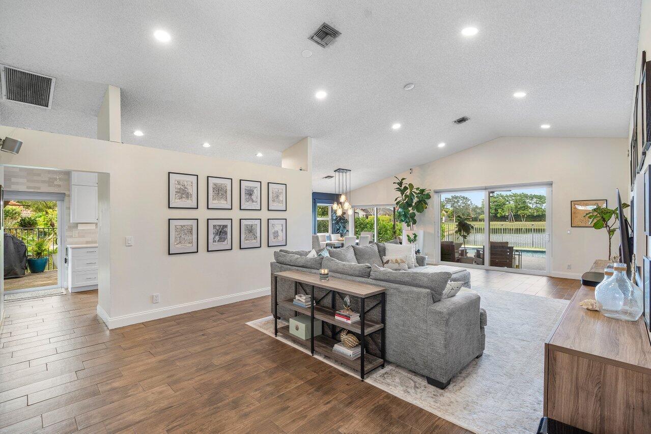 8541 Nadmar Avenue Boca Raton, FL 33434 - Photo 7 of 39 a living room with furniture and a wooden floor