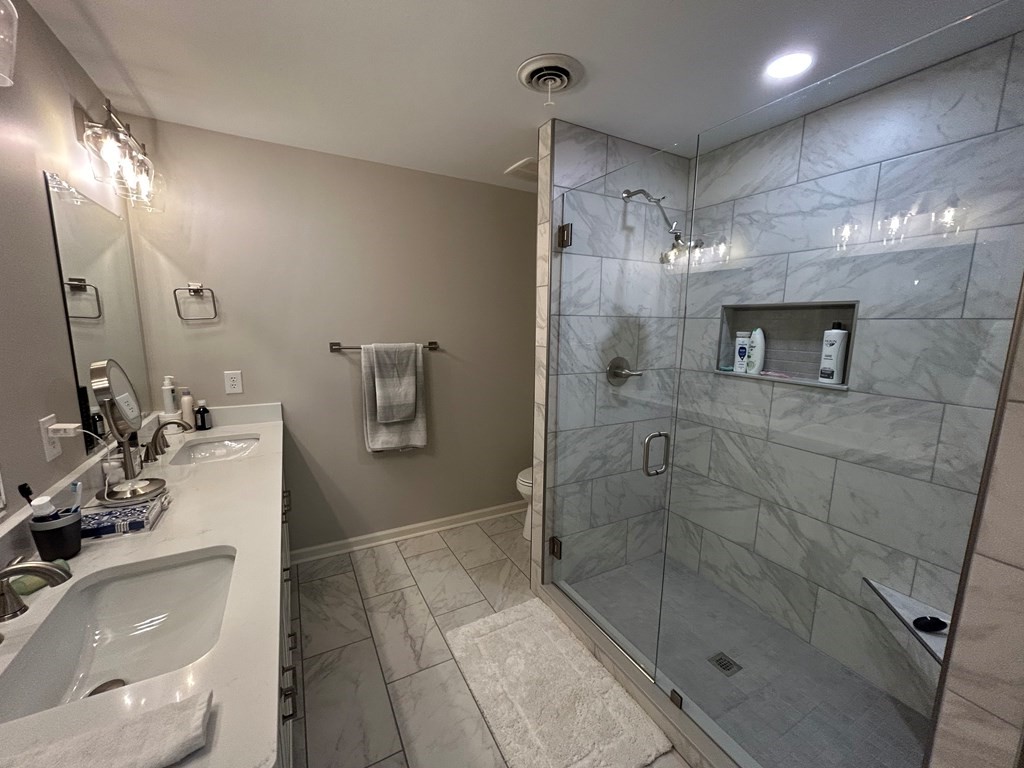 35 Pleasant Lane, Unit F3 Springville, TN 38256 - Photo 11 of 22 a bathroom with a sink a toilet and shower