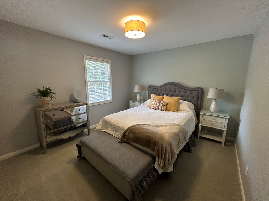 35 Pleasant Lane, Unit F3 Springville, TN 38256 - Photo 14 of 22 a bedroom with a bed and a lamp