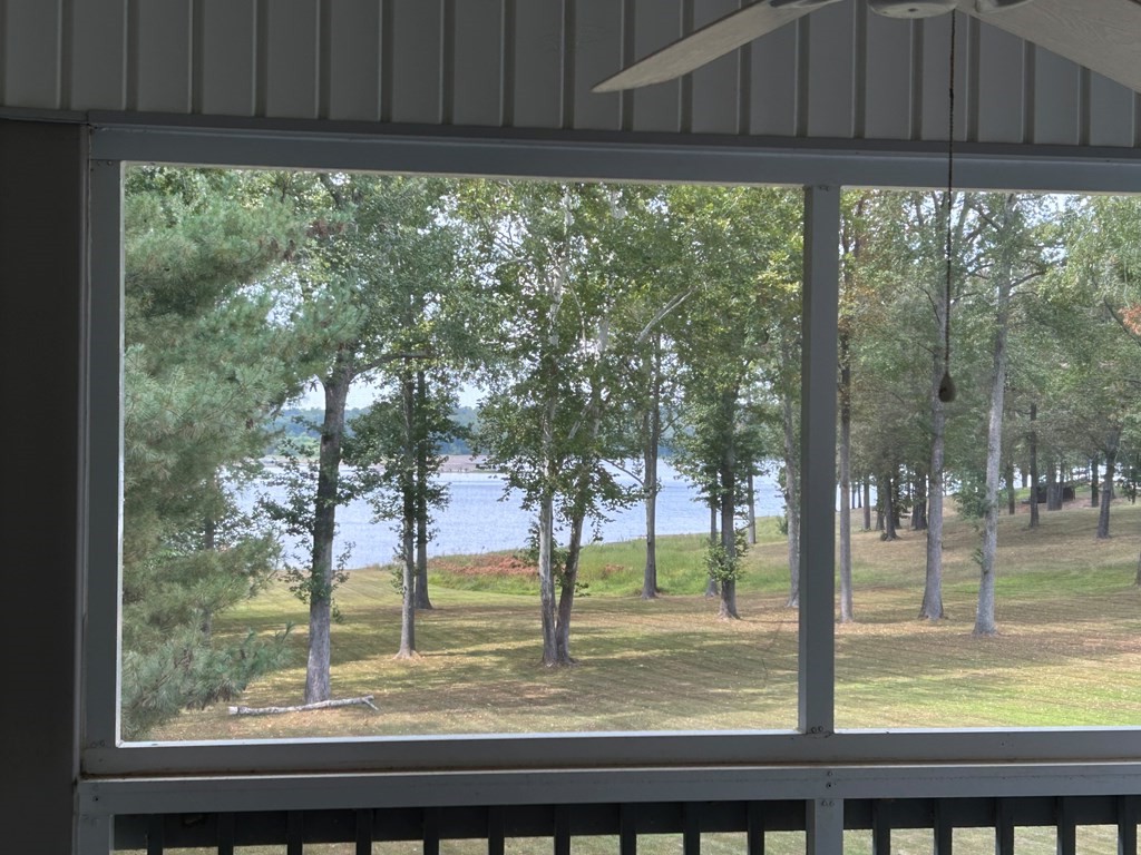 35 Pleasant Lane, Unit F3 Springville, TN 38256 - Photo 16 of 22 a view of a backyard with large trees and wooden fence