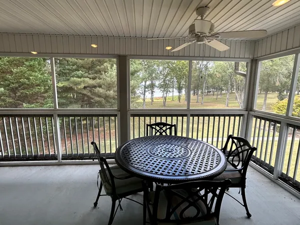 a view of a dining room with furniture window and outside view
