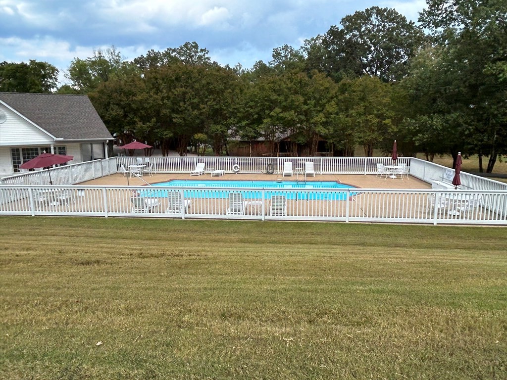 35 Pleasant Lane, Unit F3 Springville, TN 38256 - Photo 20 of 22 a view of a swimming pool with an outdoor seating and a yard