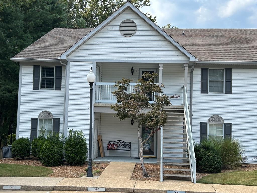 35 Pleasant Lane, Unit F3 Springville, TN 38256 - Photo 2 of 22 a front view of a house with garden