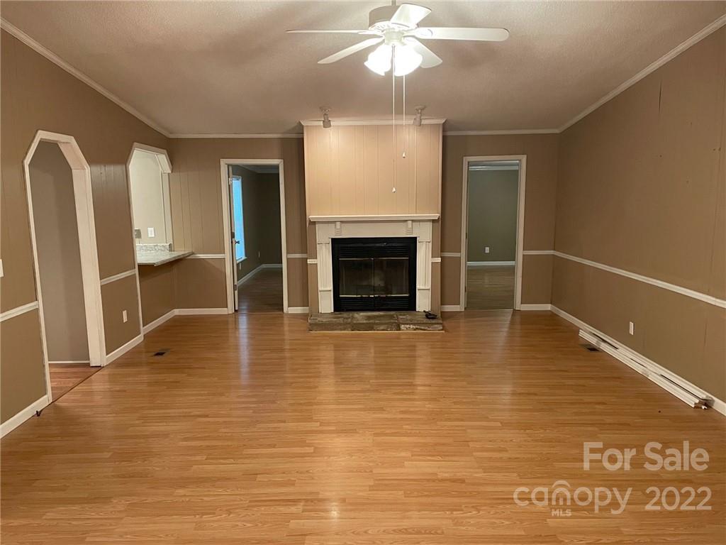 1682 Laughter Road Mill Spring, NC 28756 - Photo 14 of 24 a view of a livingroom with a fireplace