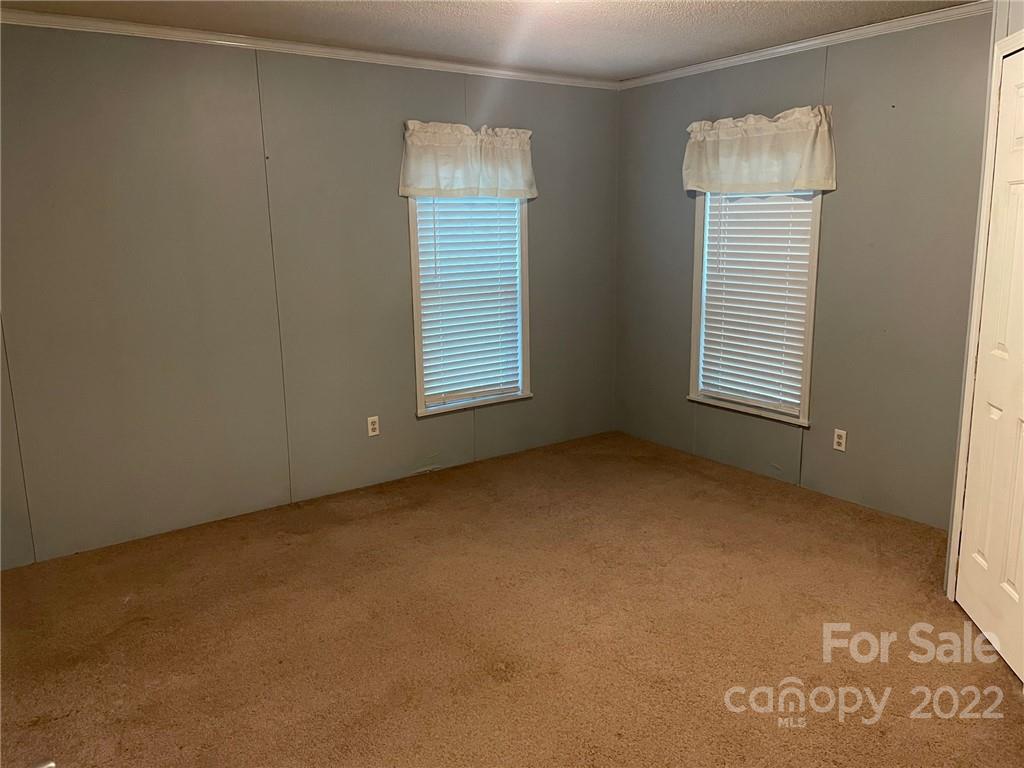 1682 Laughter Road Mill Spring, NC 28756 - Photo 21 of 24 a view of an empty room with a window