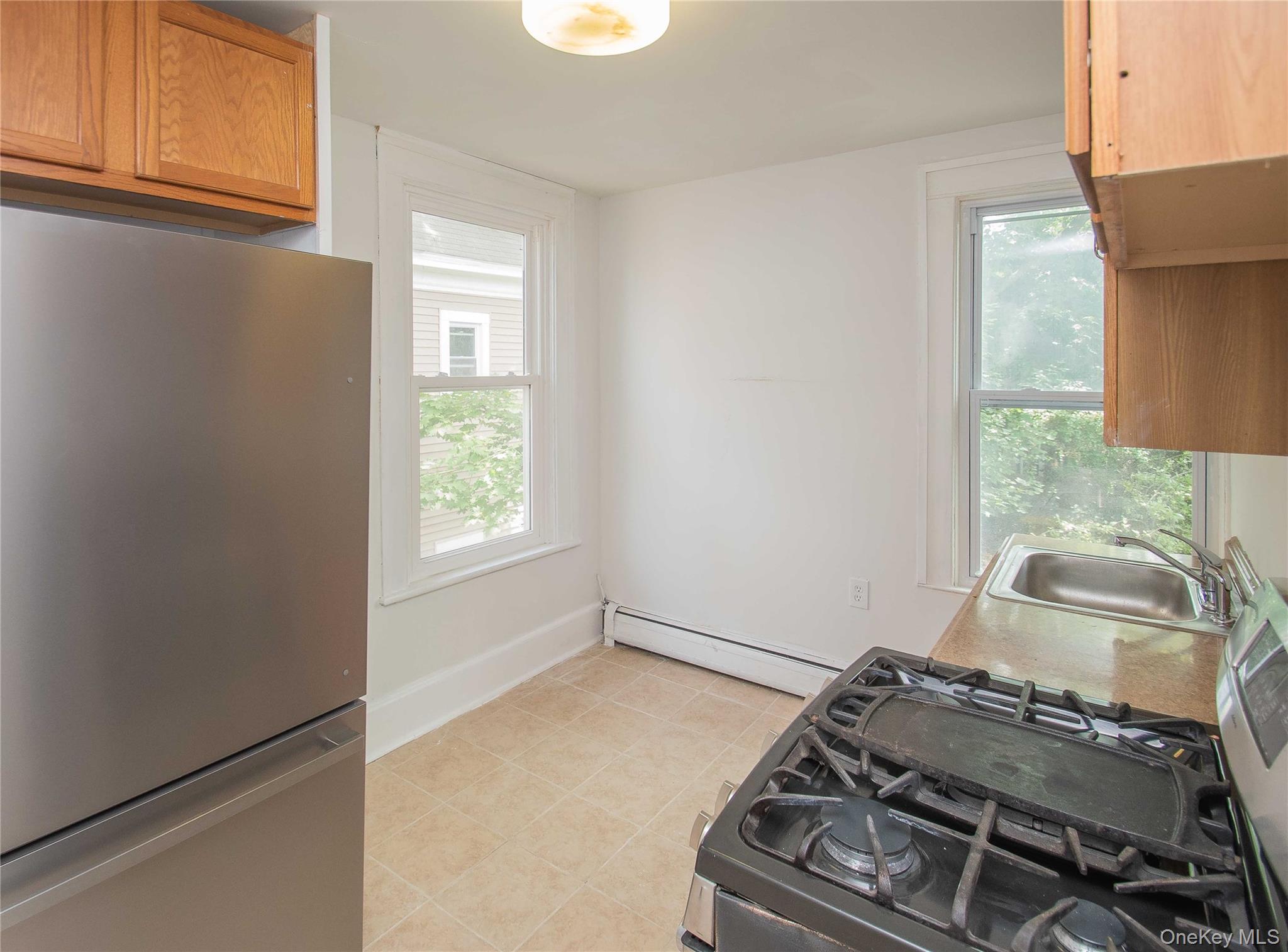 65 North Clinton Street Poughkeepsie, NY 12601 - Photo 8 of 10 a room with storage and utility