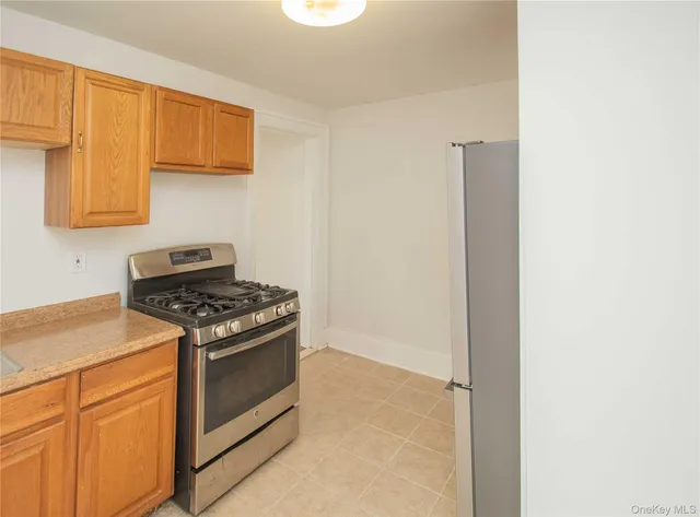 a kitchen with a stove and a microwave
