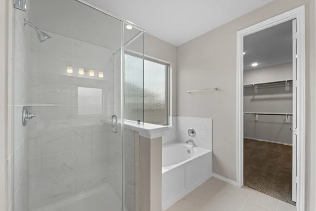 a kitchen with kitchen island granite countertop a refrigerator oven a sink and dishwasher with wooden floor