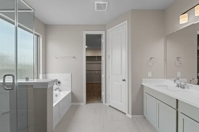a bathroom with a sink double vanity and a mirror