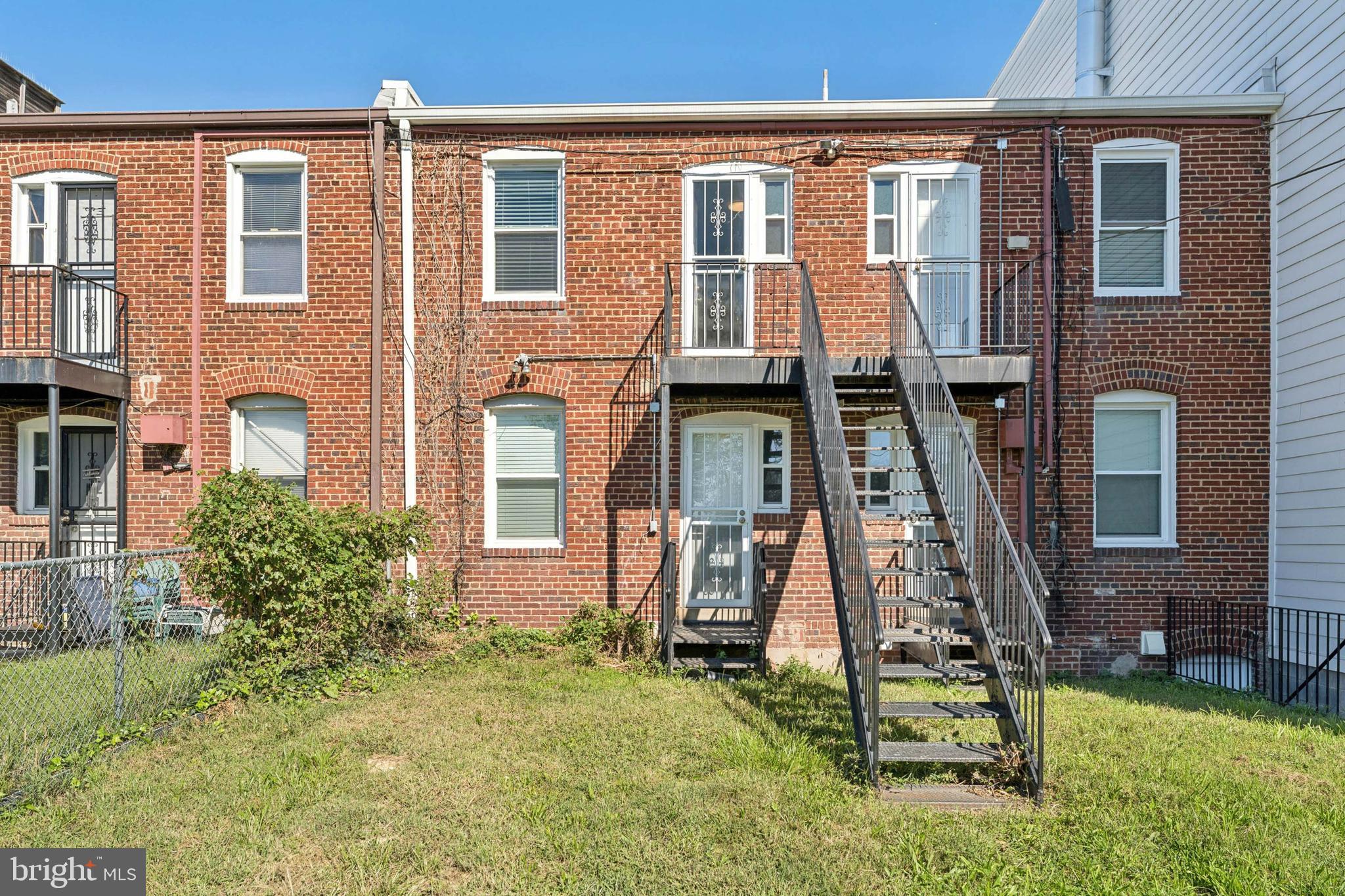 2021 E Street Northeast, Unit 4 Washington, DC 20002 - Photo 15 of 15 a front view of a house with a yard
