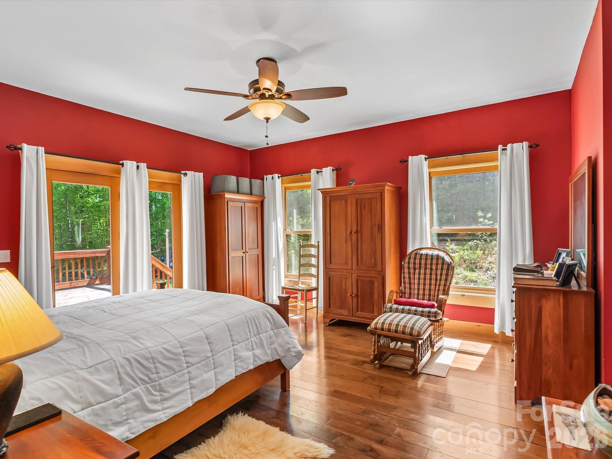 917 Otter Mountain Road Topton, NC 28781 - Photo 20 of 48 a bedroom with a bed and wooden floor