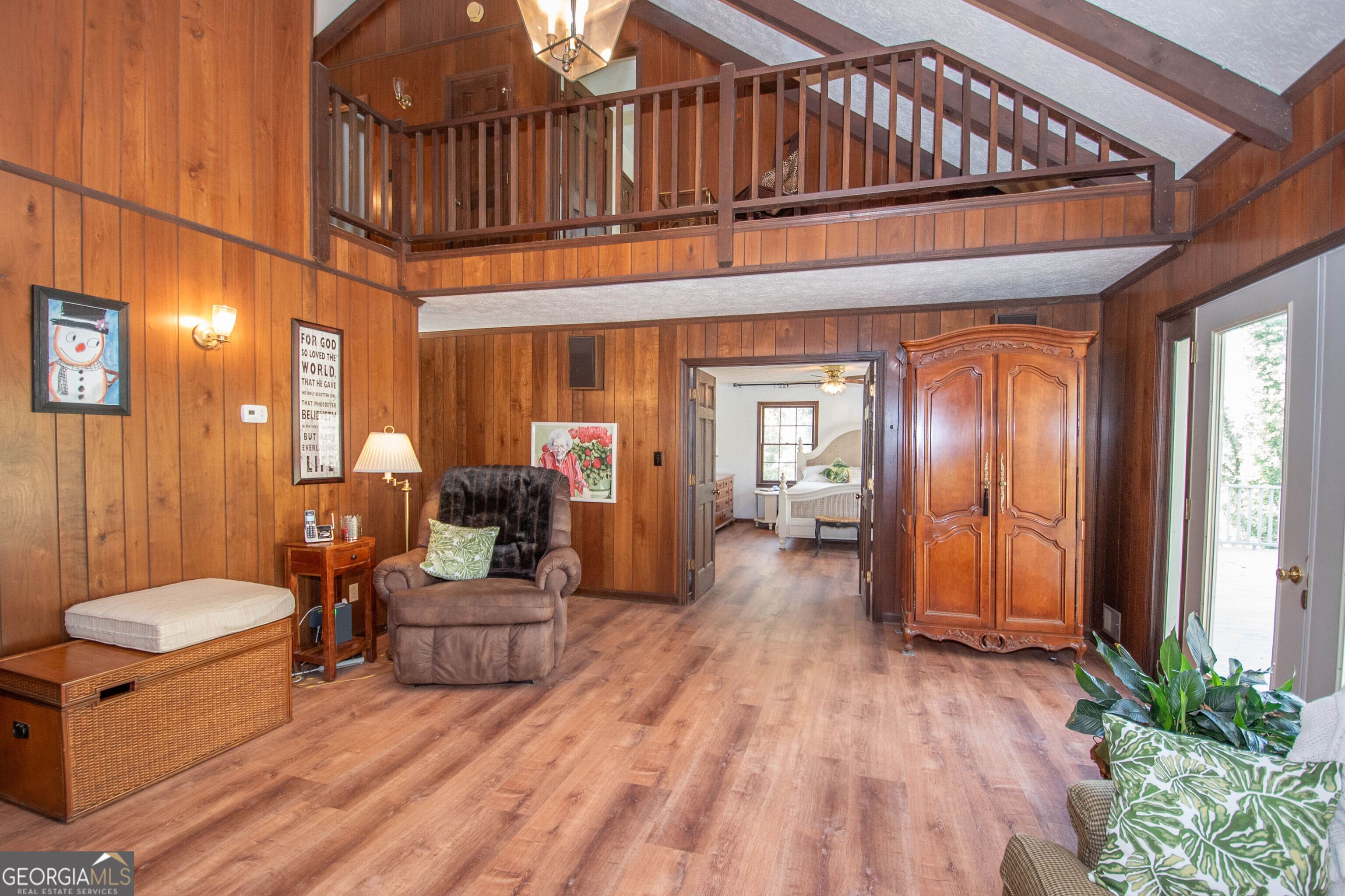 151 Evans Road Milner, GA 30257 - Photo 6 of 53 a living room with furniture a wooden floor and a large window