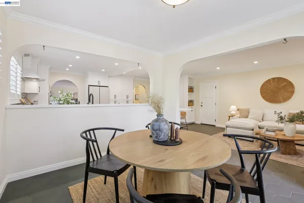 a dining room with furniture and window