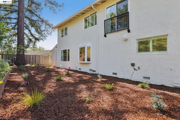 an aerial view of a house with a patio