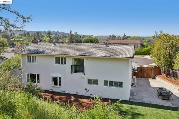 an aerial view of a house with outdoor space