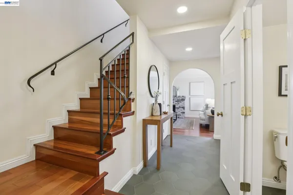 a bed room with a bed and a chair