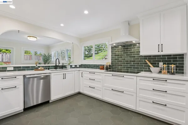 a kitchen with a sink and cabinets