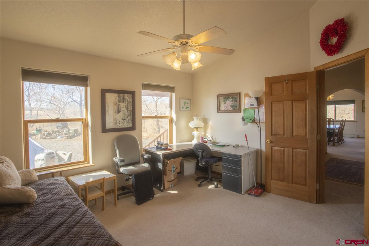 959 1200th Road Delta, CO 81416 - Photo 13 of 34 a living room with furniture and a window