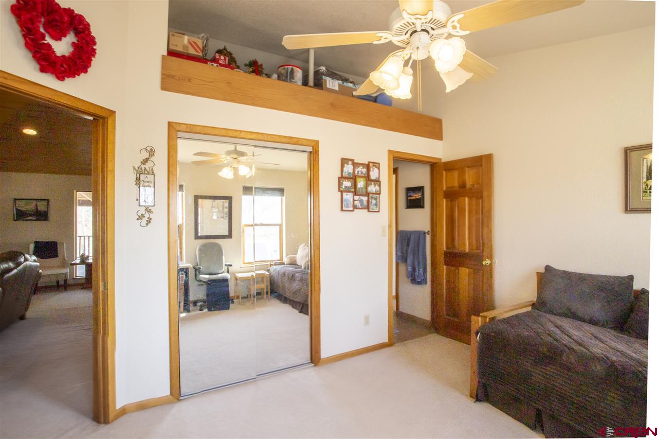 959 1200th Road Delta, CO 81416 - Photo 14 of 34 a living room with furniture and a chandelier
