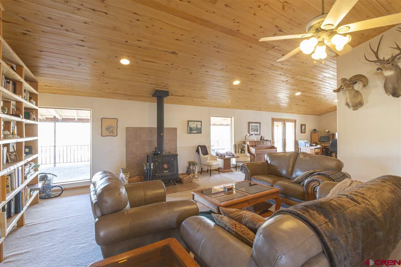 959 1200th Road Delta, CO 81416 - Photo 17 of 34 a living room with furniture and a wooden floor