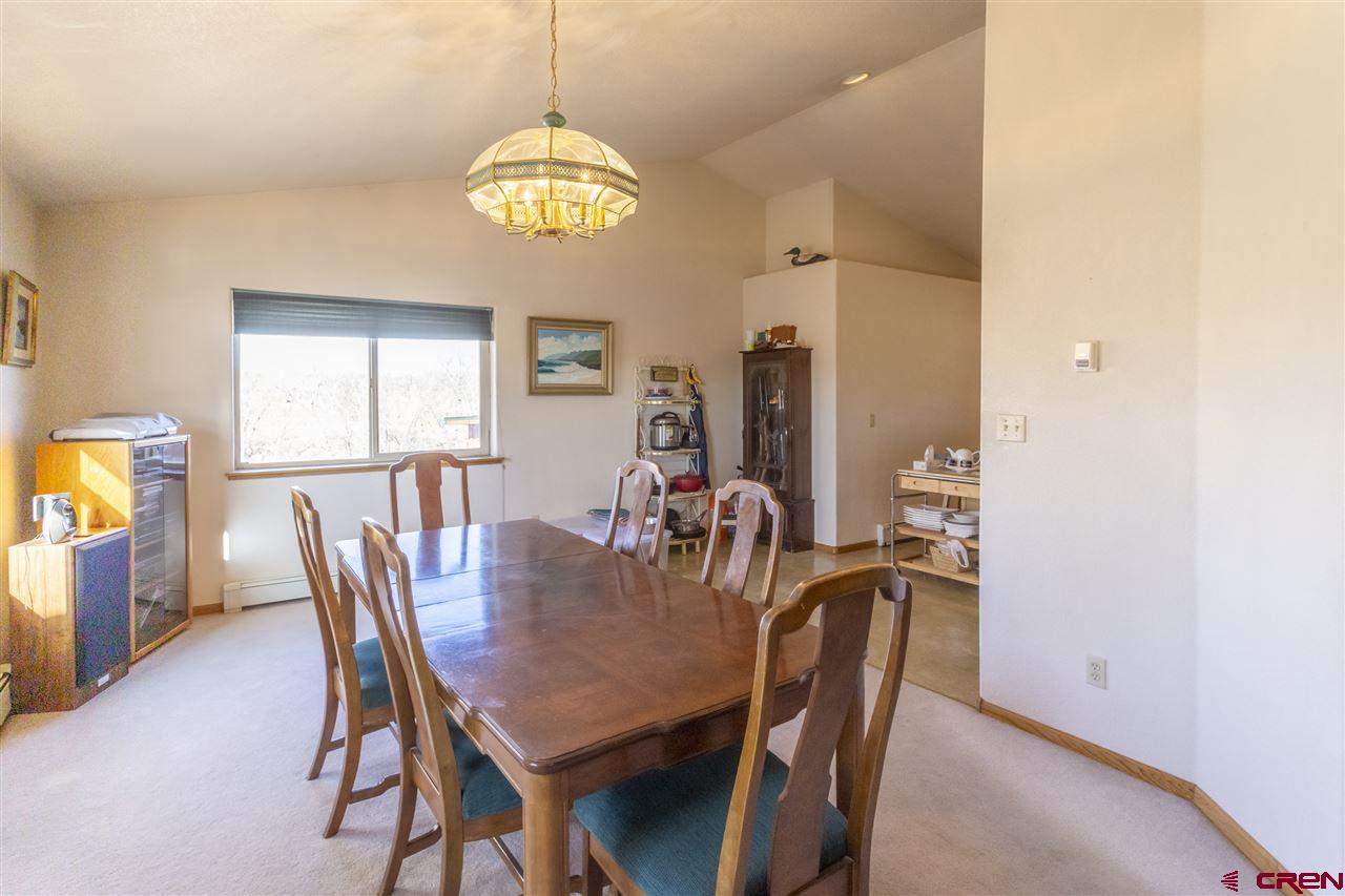 959 1200th Road Delta, CO 81416 - Photo 19 of 34 a view of a dining room with furniture and chandelier