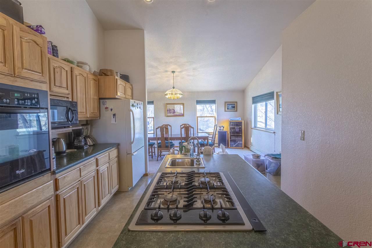959 1200th Road Delta, CO 81416 - Photo 23 of 34 a large kitchen with lots of appliances