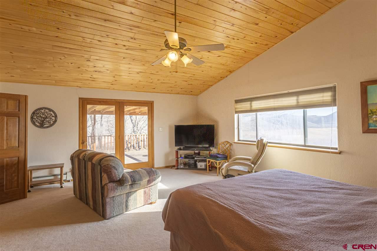 959 1200th Road Delta, CO 81416 - Photo 4 of 34 a bed room with a bed and a television