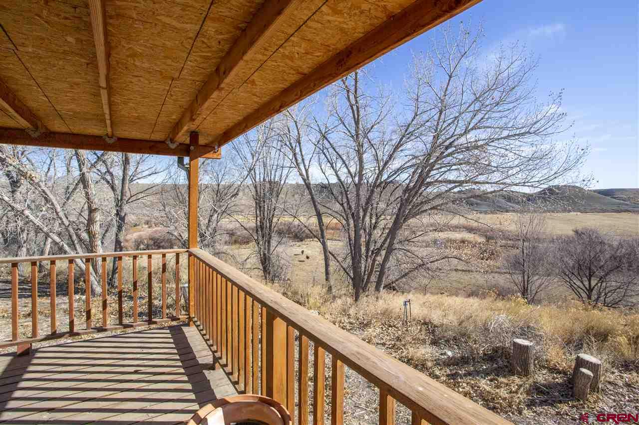 959 1200th Road Delta, CO 81416 - Photo 31 of 34 a view of a wooden deck