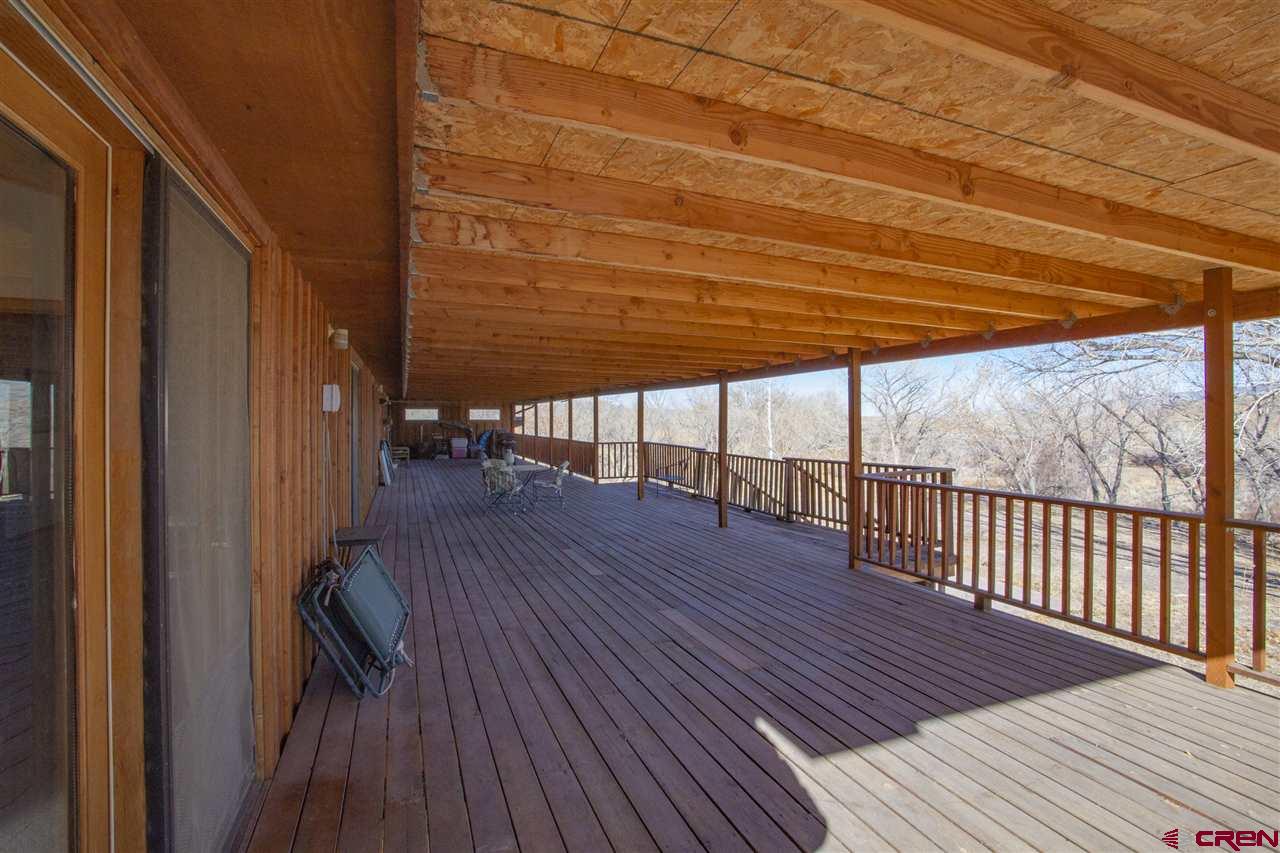 959 1200th Road Delta, CO 81416 - Photo 32 of 34 a view of a balcony with wooden floor