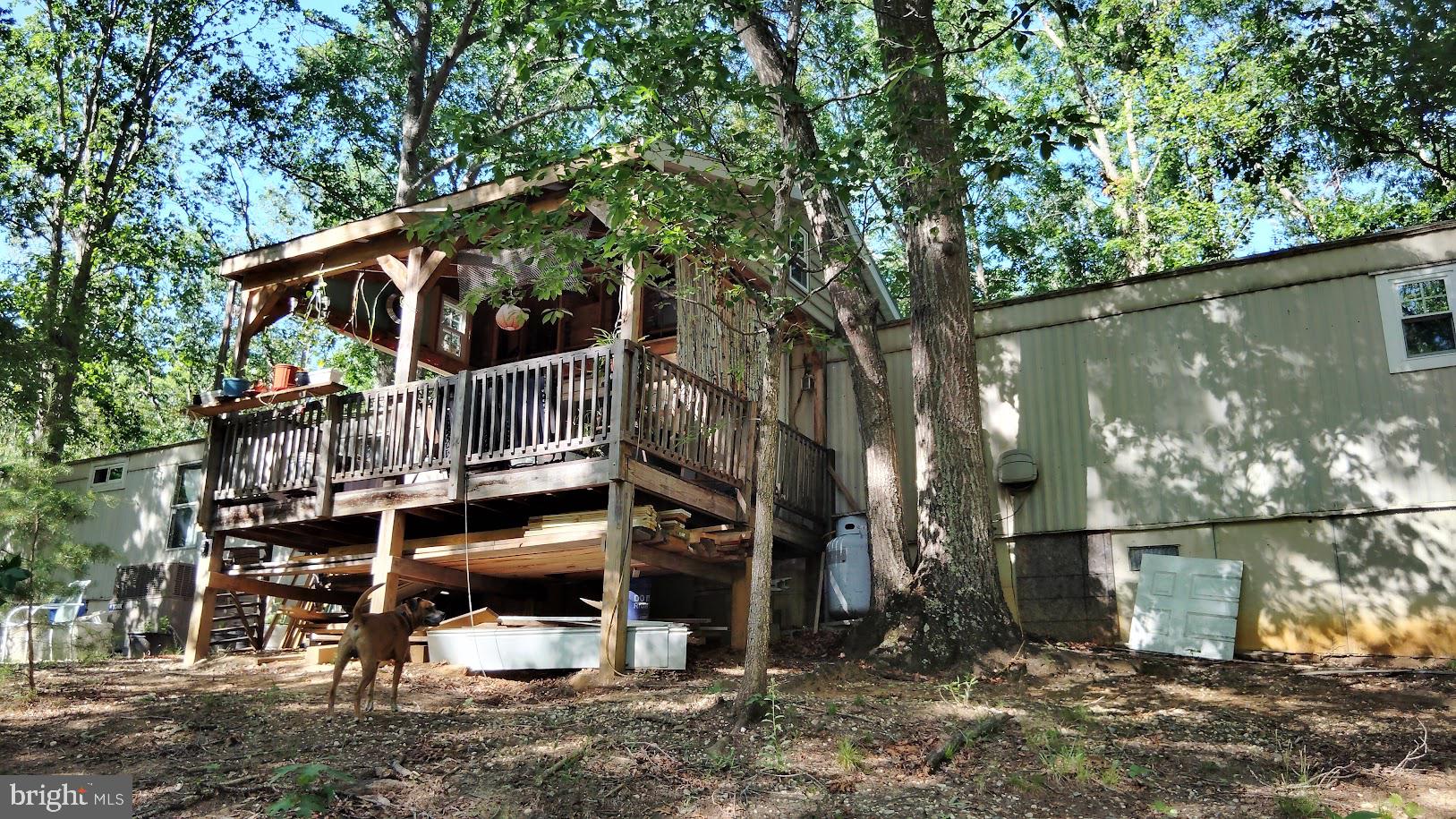 13025 Thunder Road King George, VA 22485 - Photo 7 of 34 Charming woodland retreat with deck.