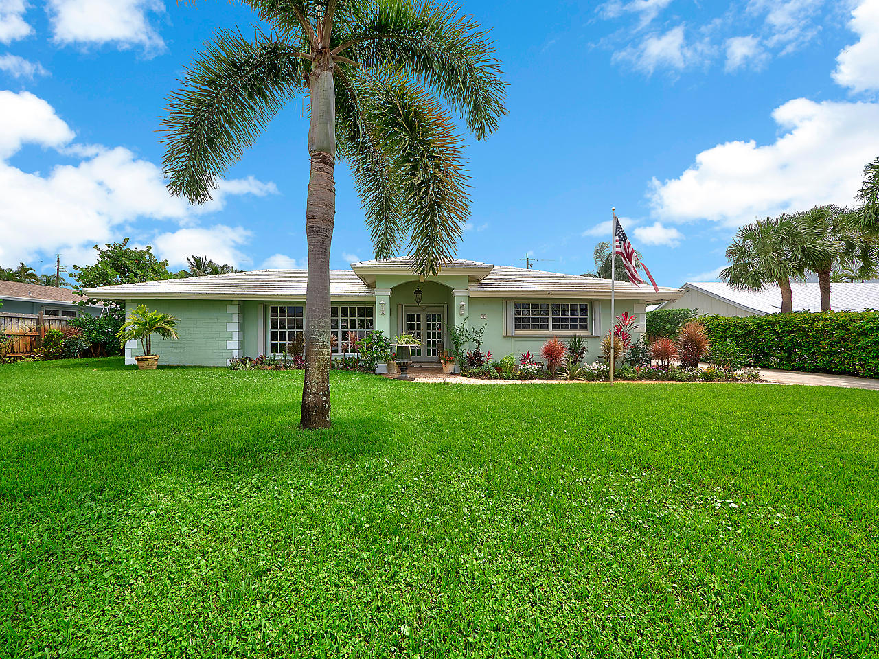 a front view of house with yard and green space