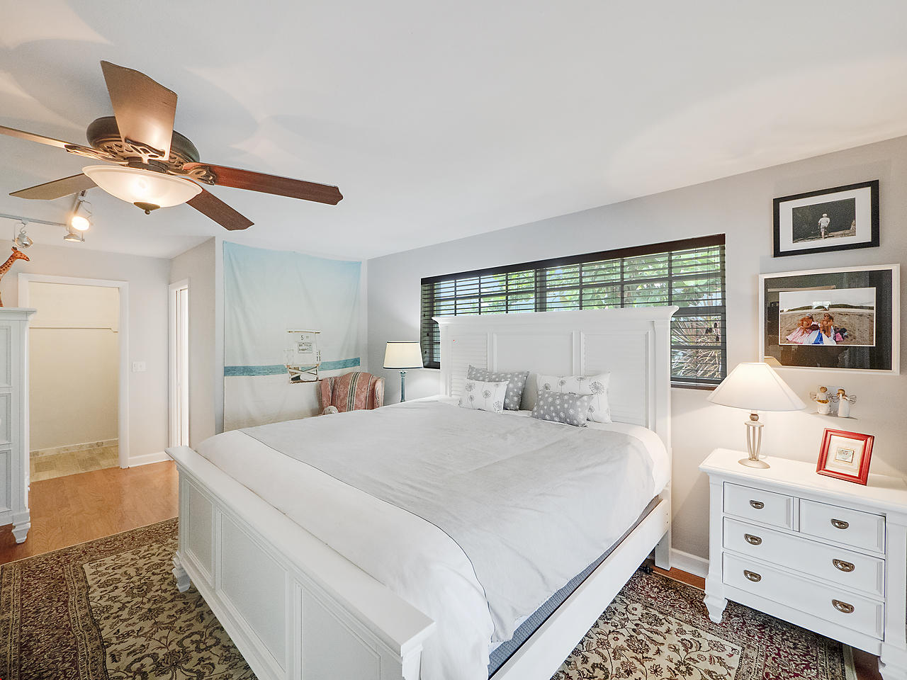 99 Golfview Drive Tequesta, FL 33469 - Photo 13 of 17 a bedroom with a bed and a dresser in it
