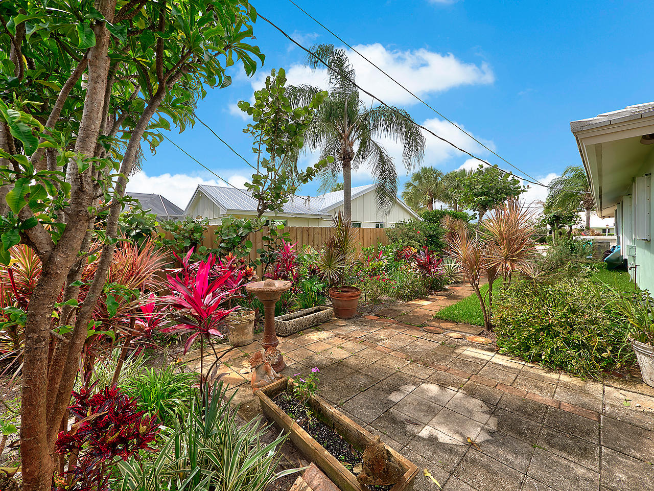 99 Golfview Drive Tequesta, FL 33469 - Photo 17 of 17 a front view of a house with a yard