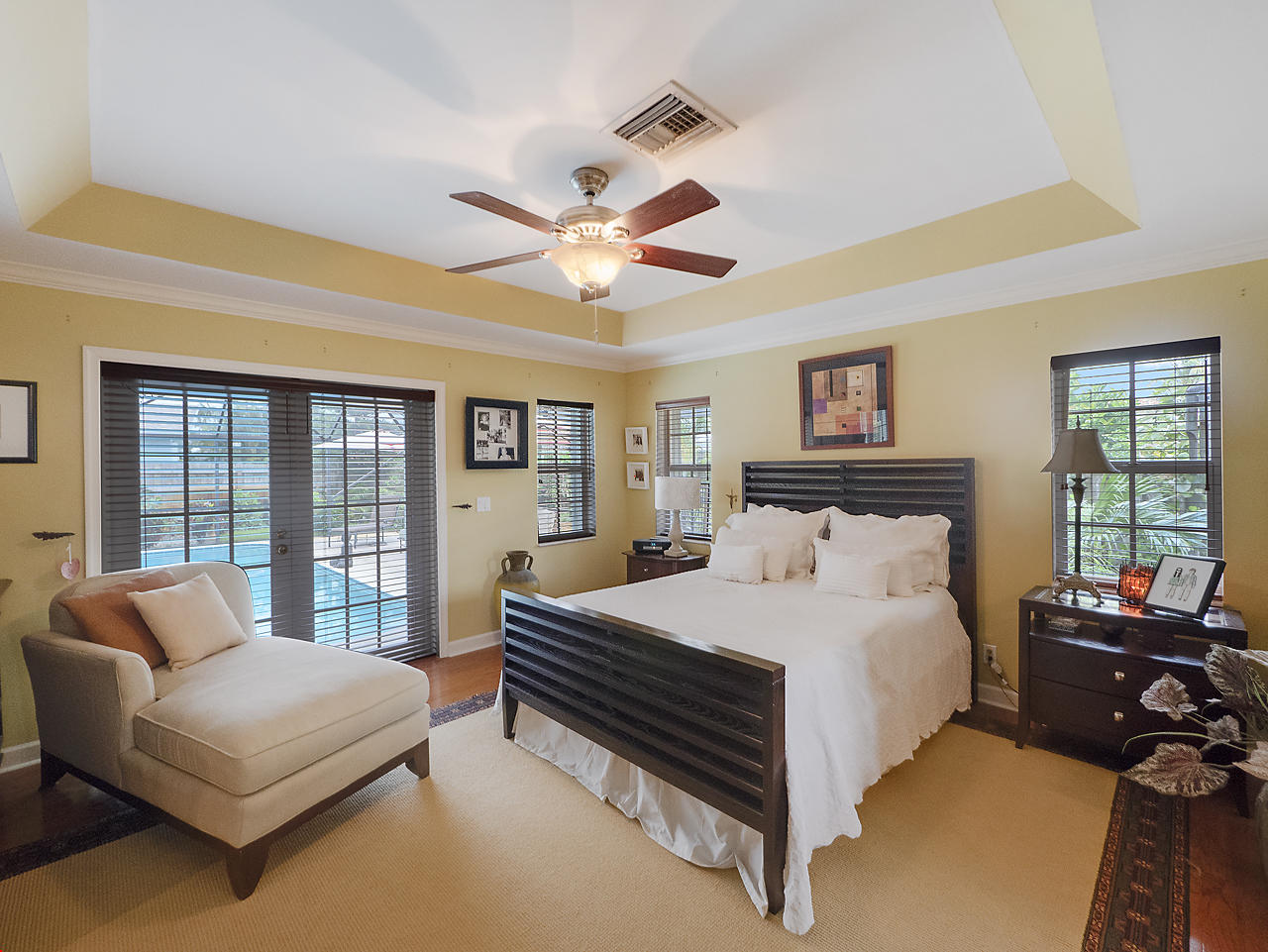 99 Golfview Drive Tequesta, FL 33469 - Photo 9 of 17 a bedroom with a bed and a couch