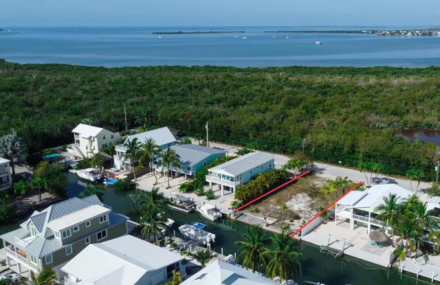 an aerial view of a house with a garden