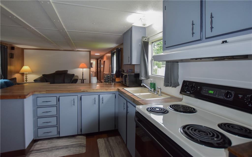 215 Maplecrest Drive Cabot, PA 16023 - Photo 13 of 15 a kitchen with a stove and a refrigerator