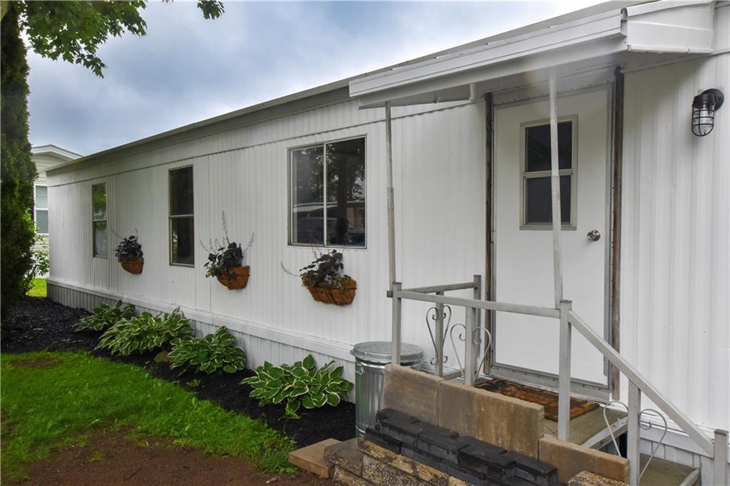 215 Maplecrest Drive Cabot, PA 16023 - Photo 2 of 15 front view of a house with potted plants