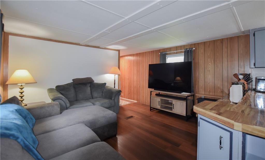 215 Maplecrest Drive Cabot, PA 16023 - Photo 3 of 15 a living room with furniture and a flat screen tv