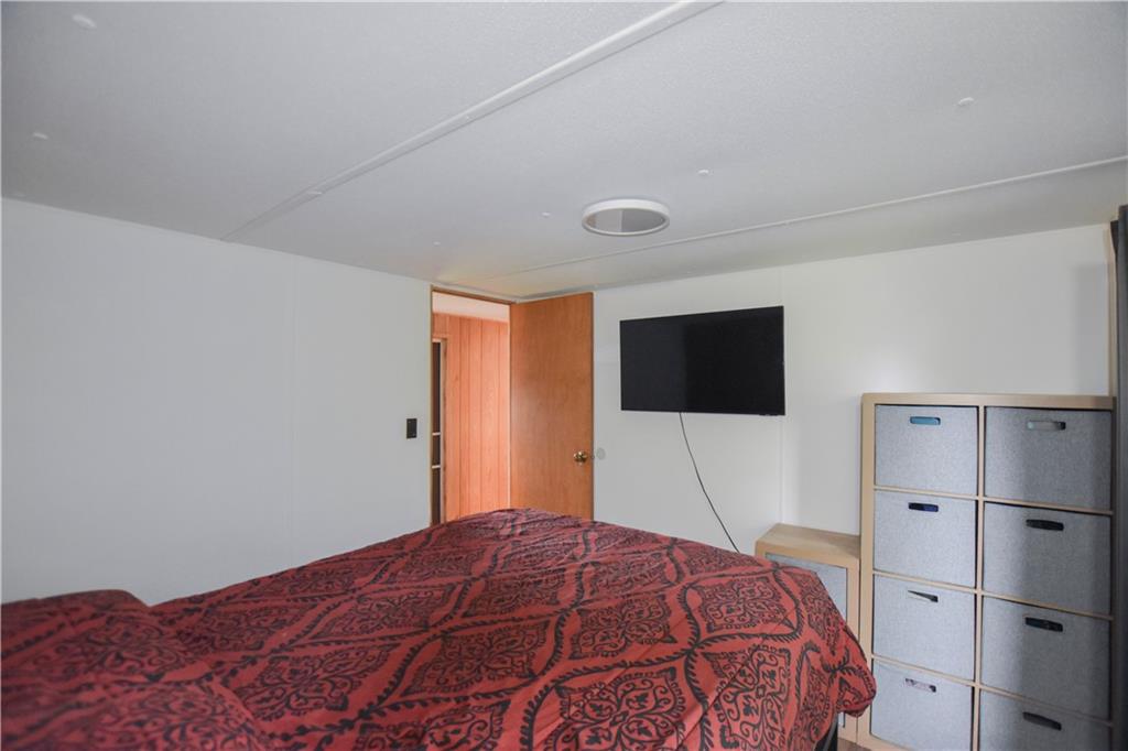 215 Maplecrest Drive Cabot, PA 16023 - Photo 7 of 15 a bedroom with a bed and a flat screen tv