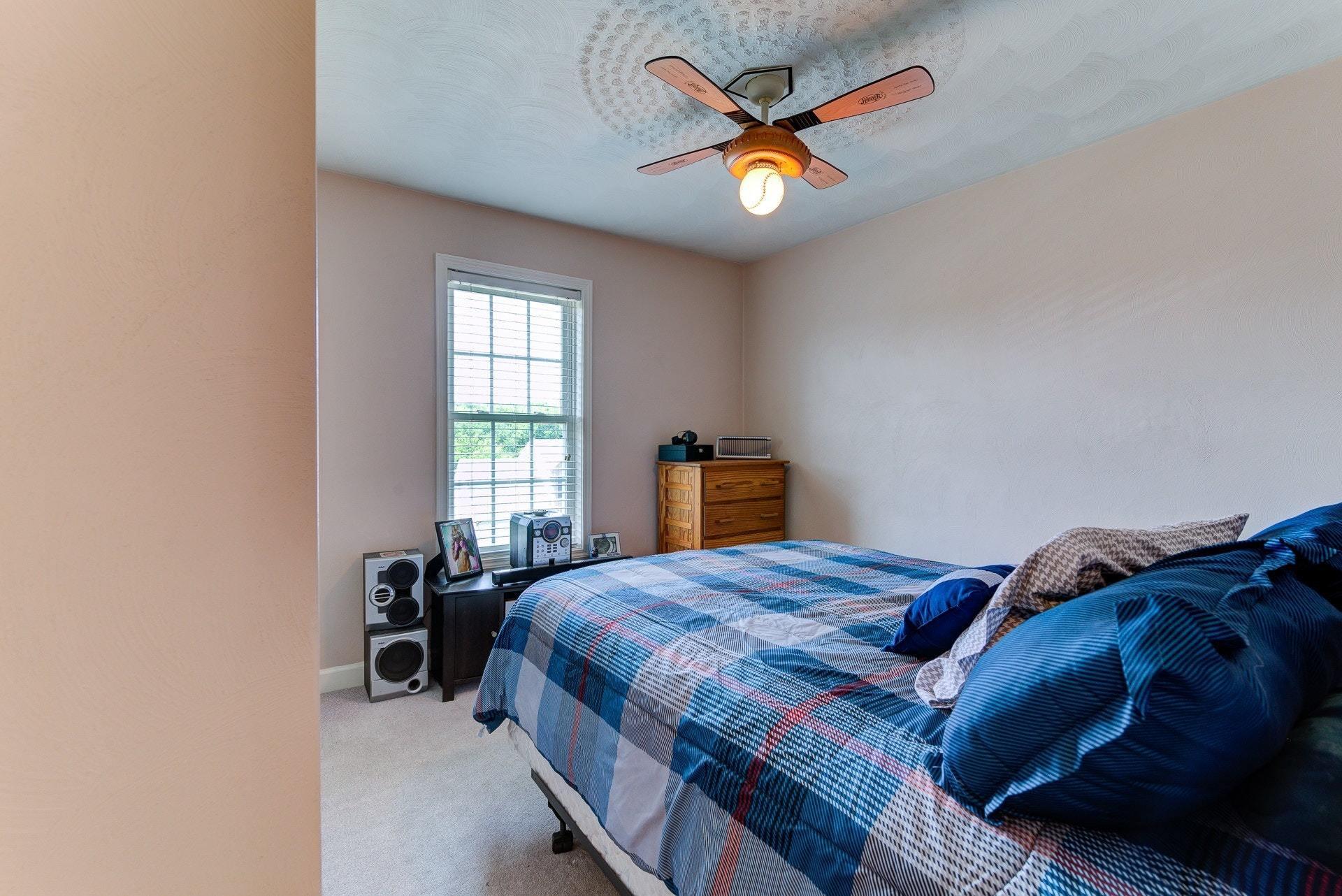 1744 Meadows Road Vinton, VA 24179 - Photo 19 of 36 a bedroom with a bed and a window