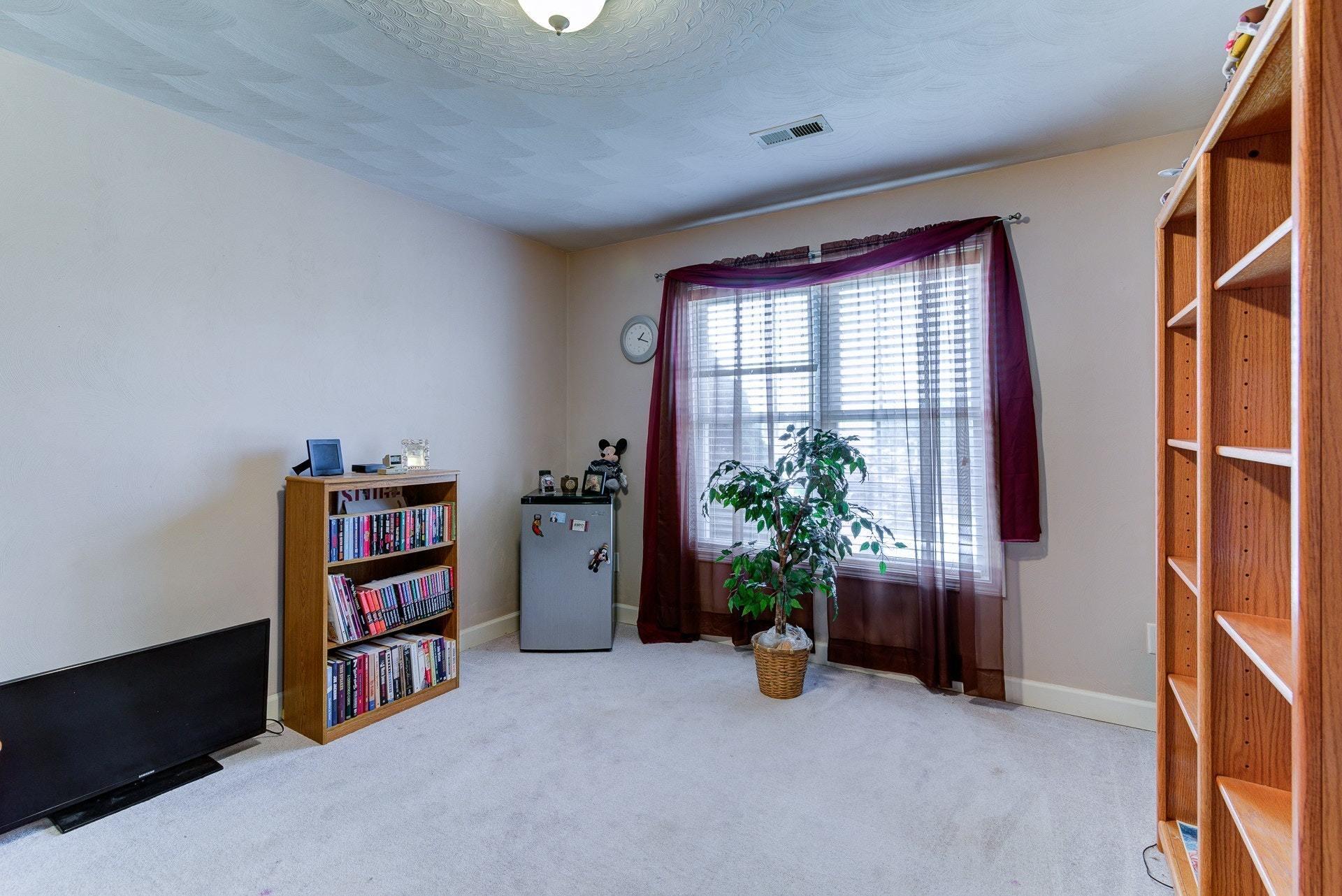 1744 Meadows Road Vinton, VA 24179 - Photo 21 of 36 a view of room with furniture and window