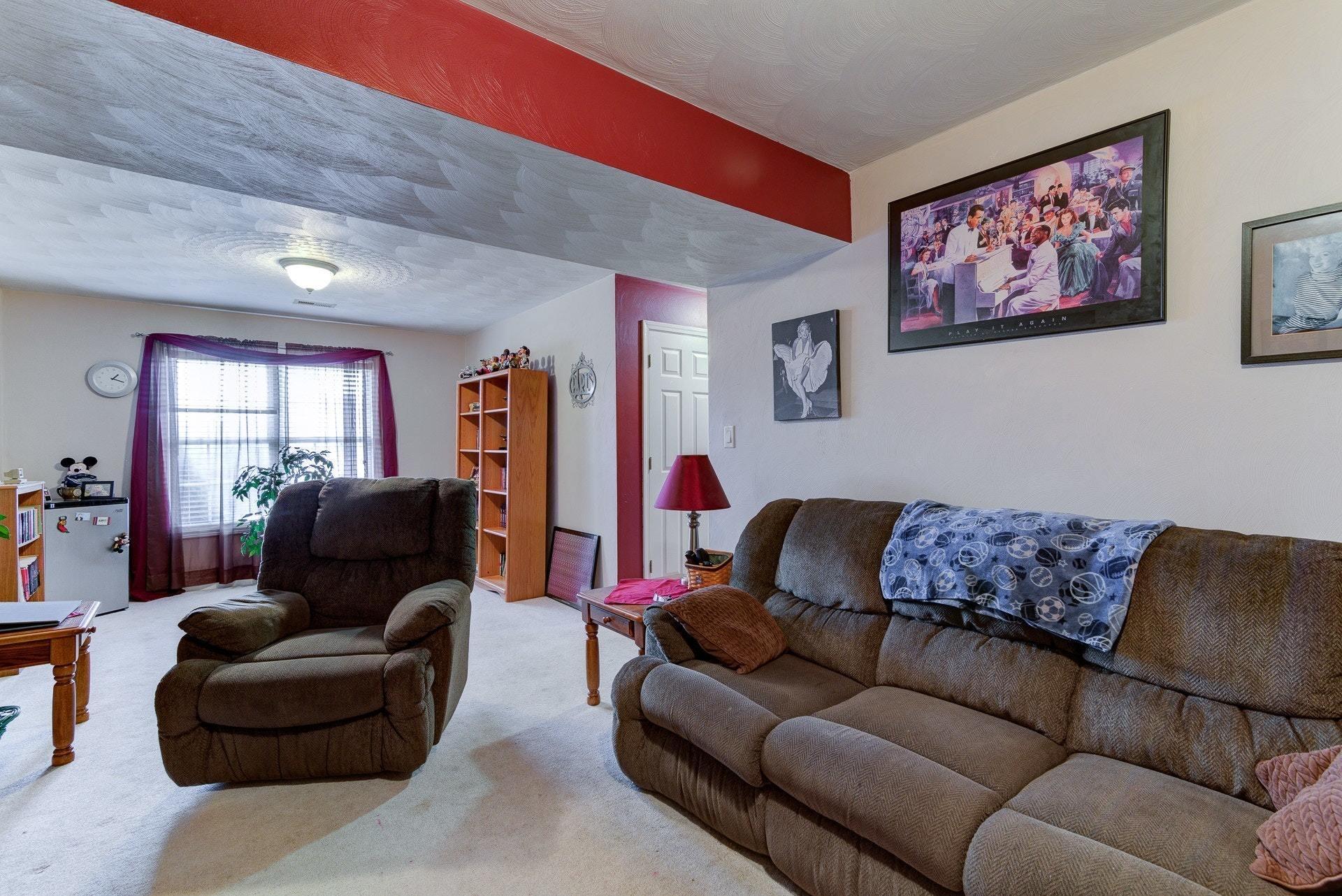 1744 Meadows Road Vinton, VA 24179 - Photo 24 of 36 a living room with furniture and a couch