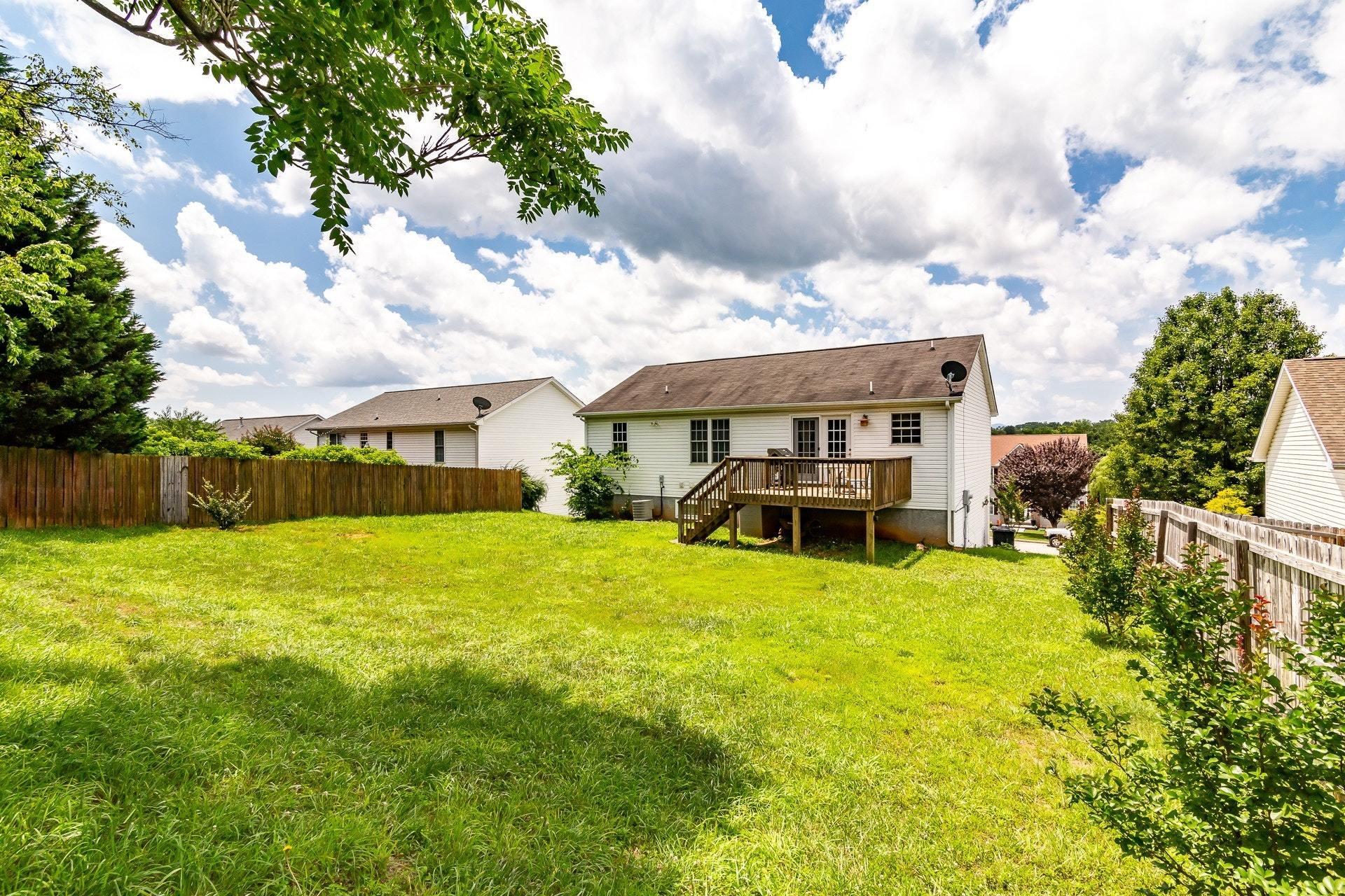 1744 Meadows Road Vinton, VA 24179 - Photo 31 of 36 a view of a house with pool and chairs next to yard