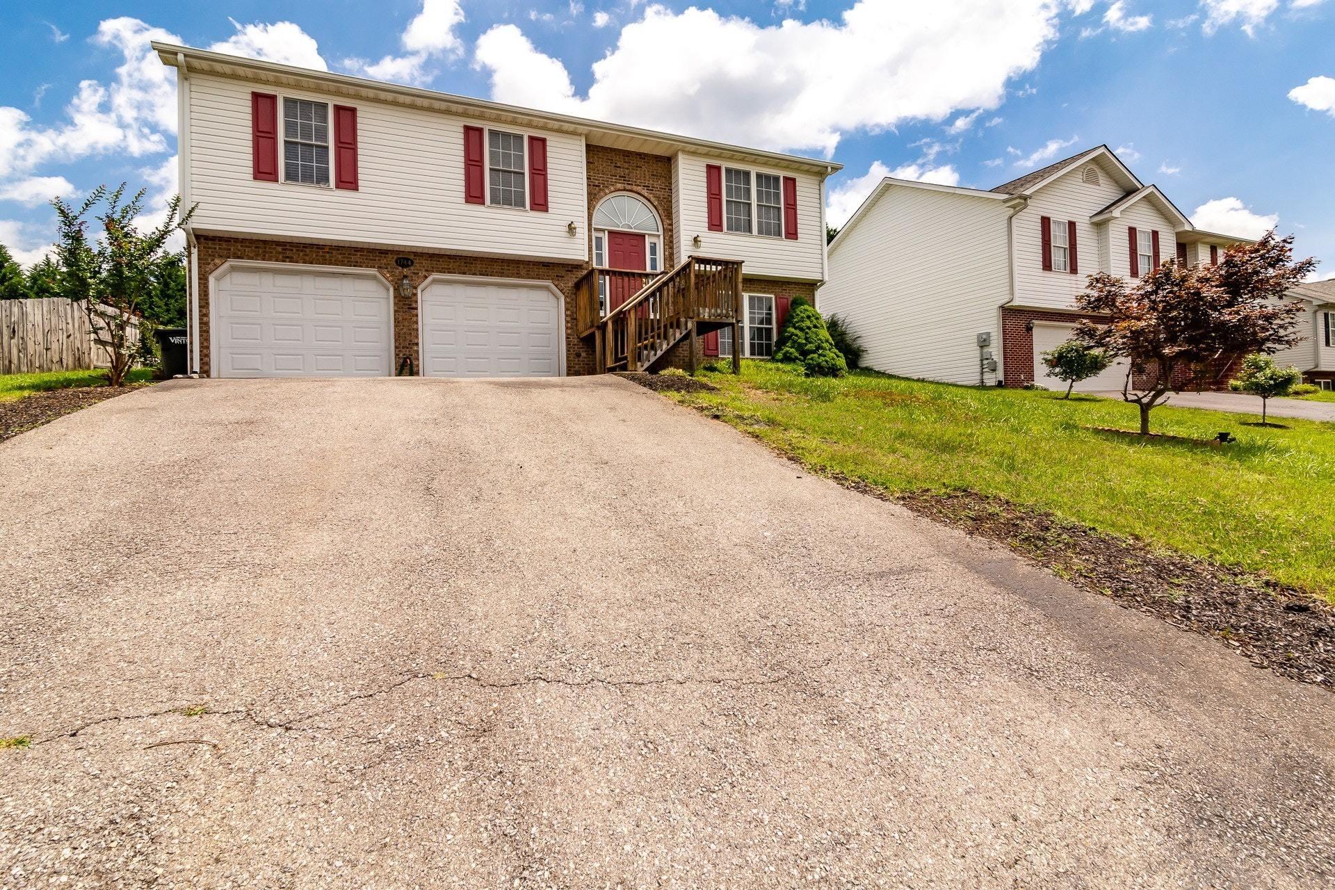 1744 Meadows Road Vinton, VA 24179 - Photo 34 of 36 a view of a house with backyard and a tree