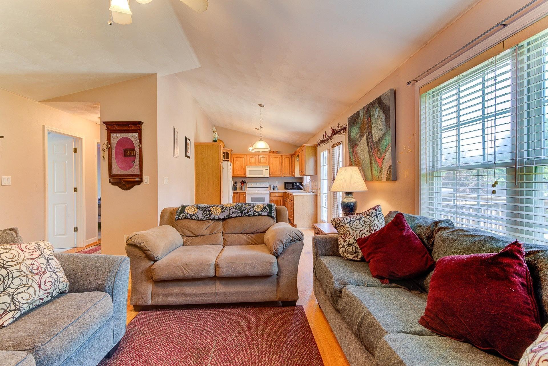 1744 Meadows Road Vinton, VA 24179 - Photo 6 of 36 a living room with furniture and a large window