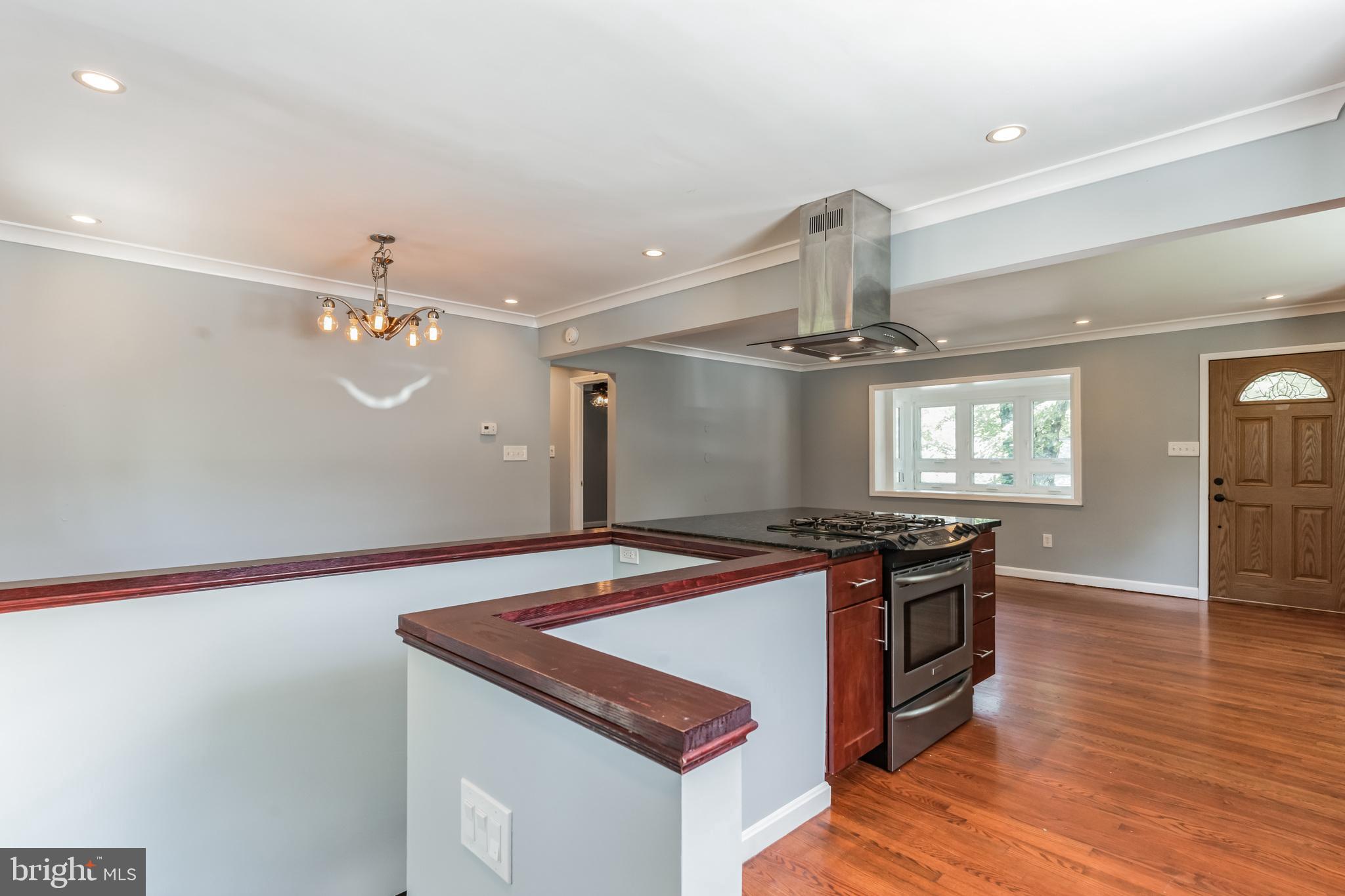 1316 South Buchanan Street Arlington, VA 22204 - Photo 11 of 28 a kitchen with stainless steel appliances granite countertop a sink stove and refrigerator