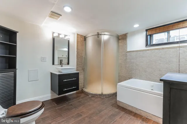 a bathroom with a sink a toilet and a bathtub