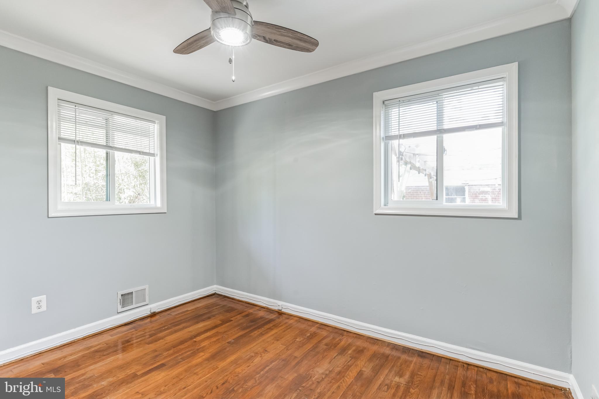 1316 South Buchanan Street Arlington, VA 22204 - Photo 20 of 28 a view of room with window and ceiling fan