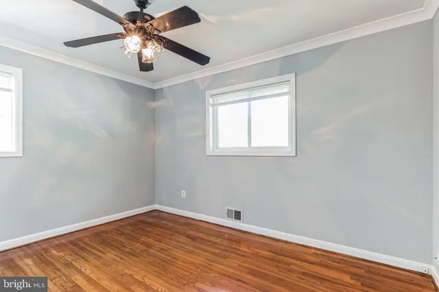 a view of entryway with wooden floor and stairs